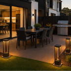 Modern house exterior with outdoor dining area and landscaped garden at dusk.